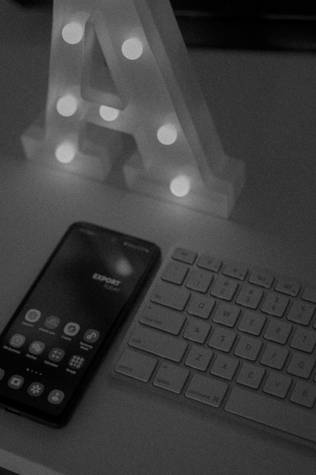 Writing a letter at a bright desk with a phone nearby