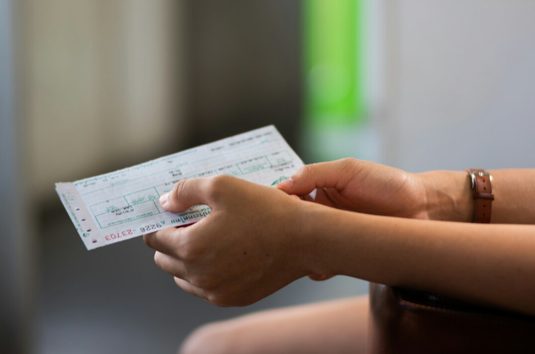 Hands with calculator and paper documents for household budget