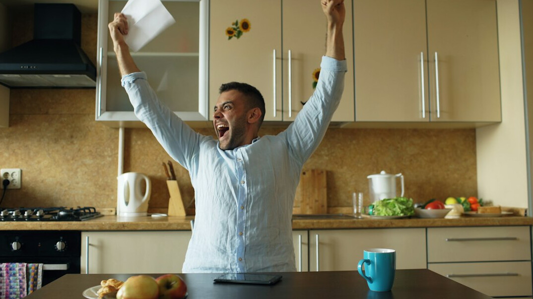 person celebrating financial milestone