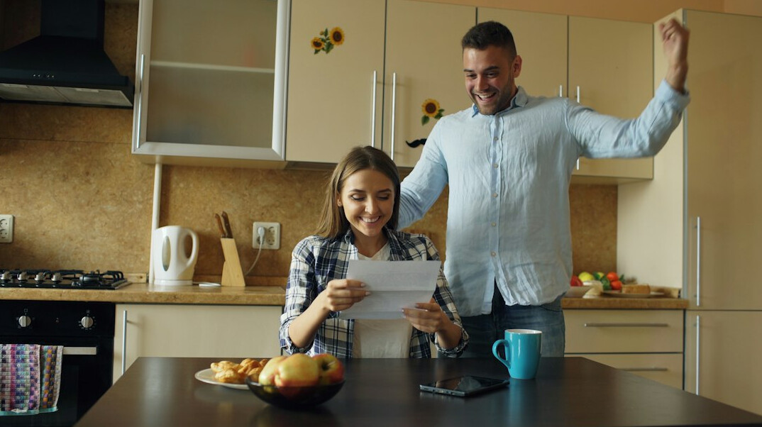 family discussing budget at kitchen table