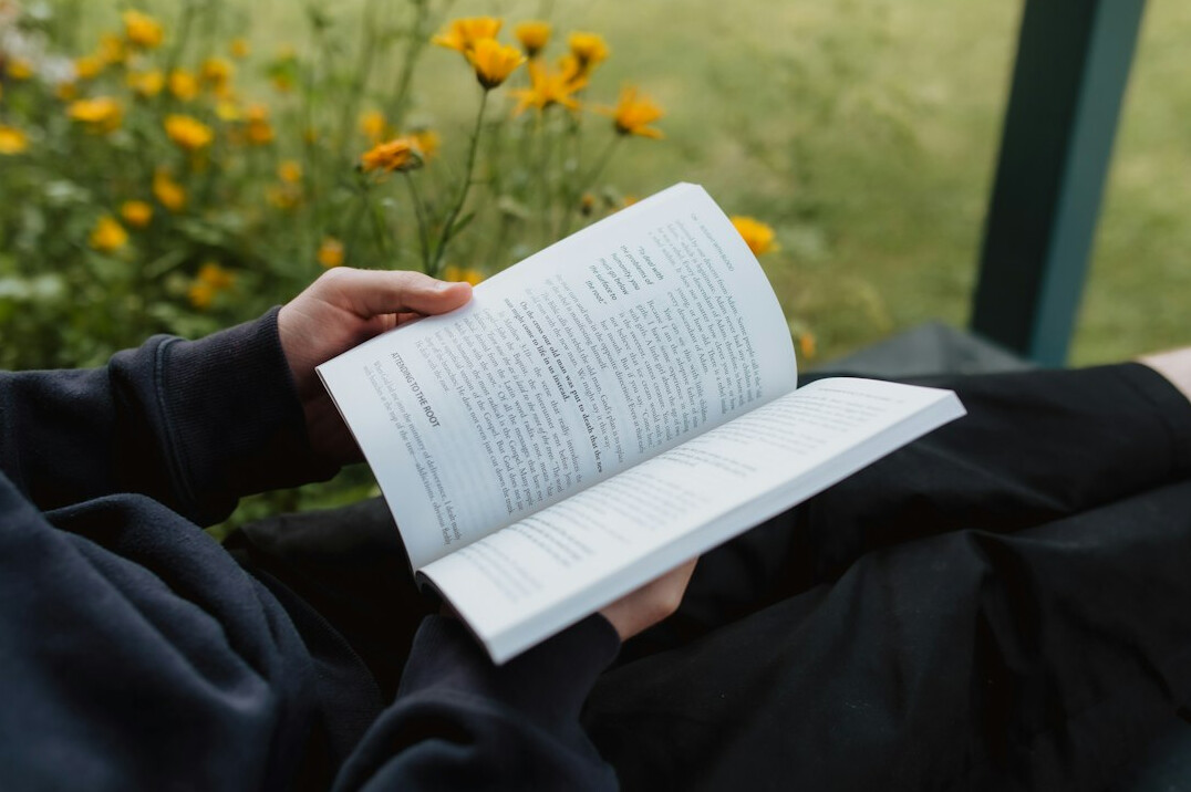person relaxing with book