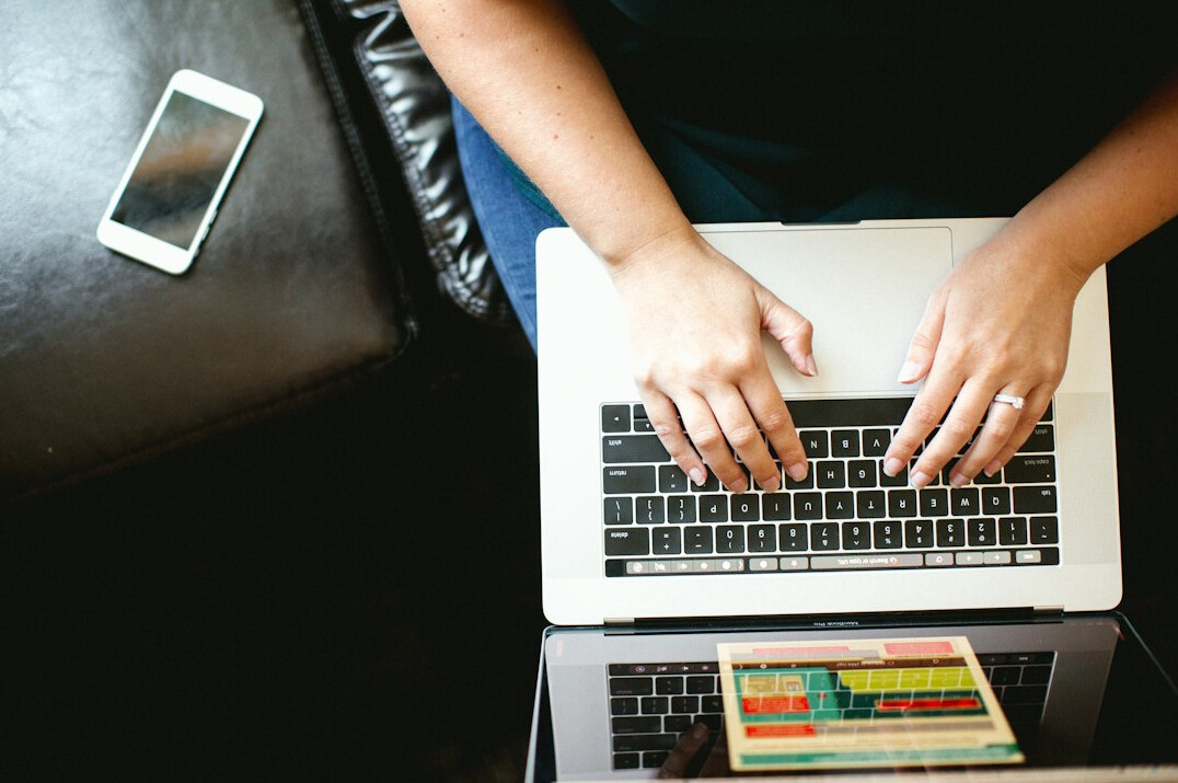 person planning budget on laptop